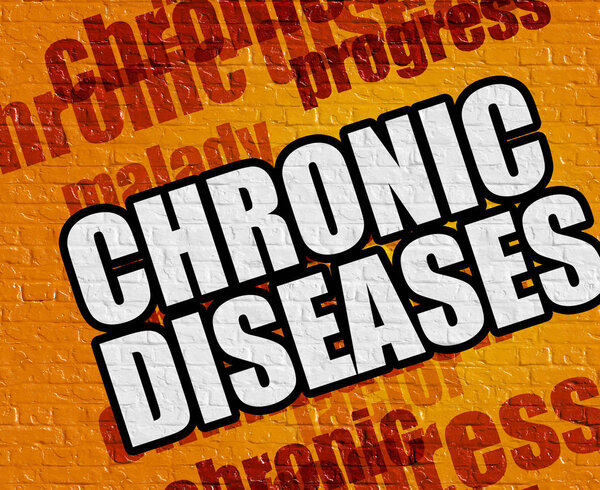 Современная концепция здоровья: Хронические заболевания на желтом кирпичном стенде
 