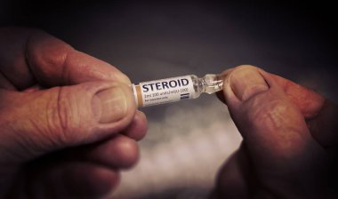 Injection of Steroid Ampoule in a Wrinkled Hands. clipart
