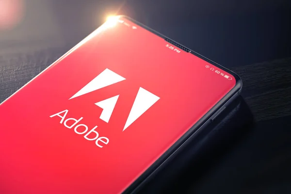 KYIV, UKRAINE-JANUARY, 2020: Adobe på smarttelefonskärmen. Tredimensionell. — Stockfoto