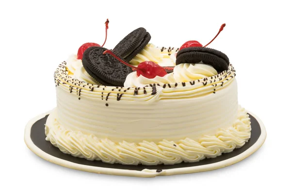 Beyaz krema, vişne ve çikolata ile süslenmiş doğum günü pastası