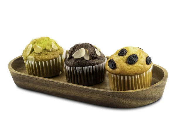 Verschillende soorten muffins in houten dienblad — Stockfoto