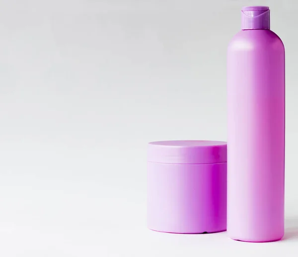 Purple containers for cosmetics — Stock Photo, Image