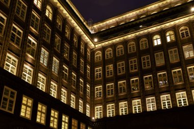 Hamburg, Germany. The Chile House (German: Chilehaus ), inner courtyard, in the evening. Located in the Kontorhaus quarter it is a 1920s Brick Expressionism style architecture