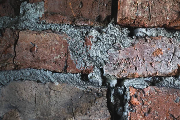 Texture of an old brick wall in a closet.