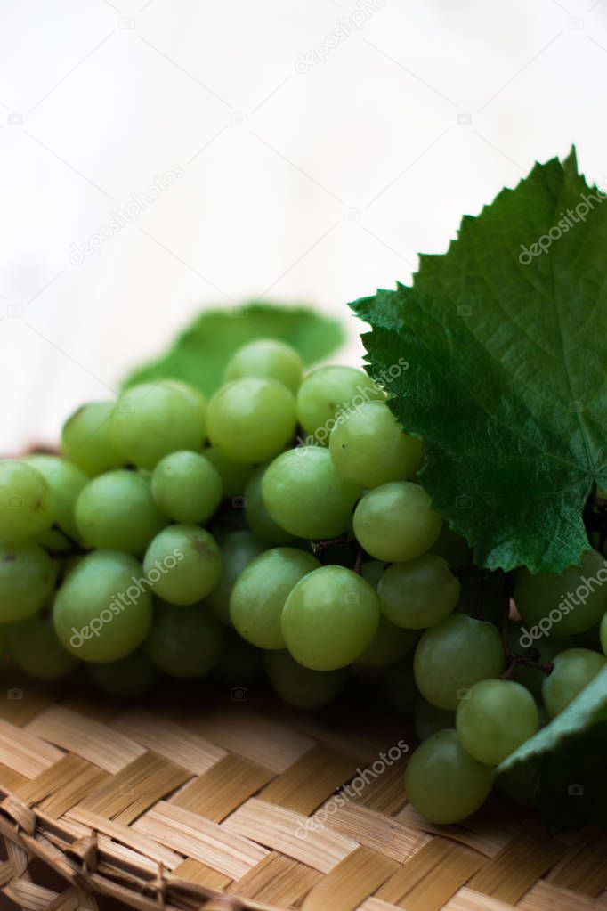 Grapes of grapes on a wooden table.