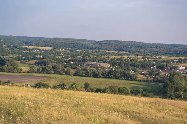 Summer sunny landscape at sunset of the day outside the city. — Stock Photo, Image