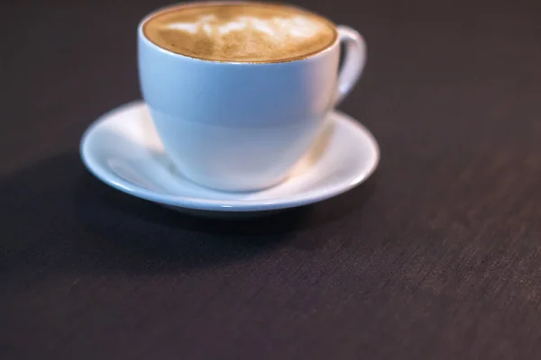 Ένα φλιτζάνι καφέ με μια εικόνα σε ένα καφέ. — Φωτογραφία Αρχείου