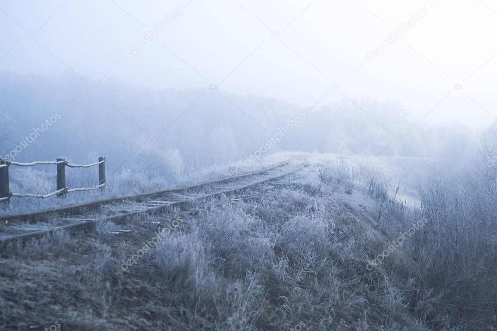 Winter landscape. Railway on a frosty morning.