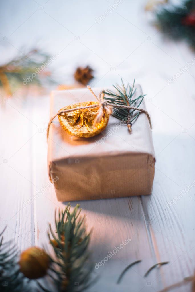 Christmas gifts with dried orange slices on a white background