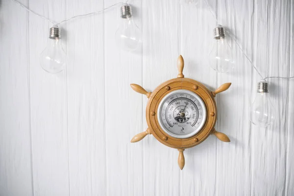 Sea barometer on a white wooden background — Stock Photo, Image