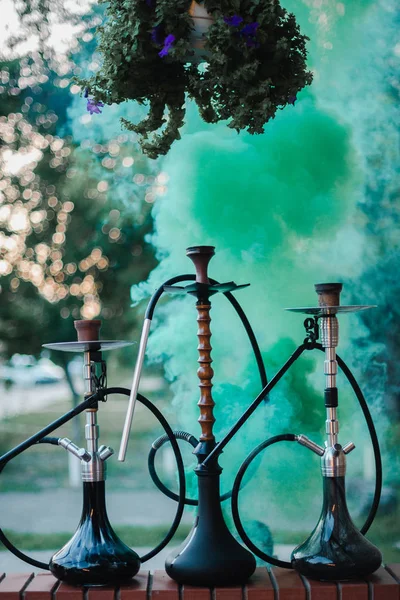 Hookah outdoors on a background of colored smoke — Stock Photo, Image