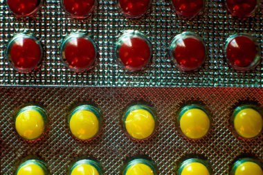 Colored pills close-up. Coronavirus vaccine concept macro