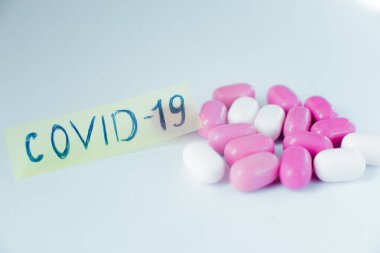 Colored pills close-up. Coronavirus vaccine concept macro