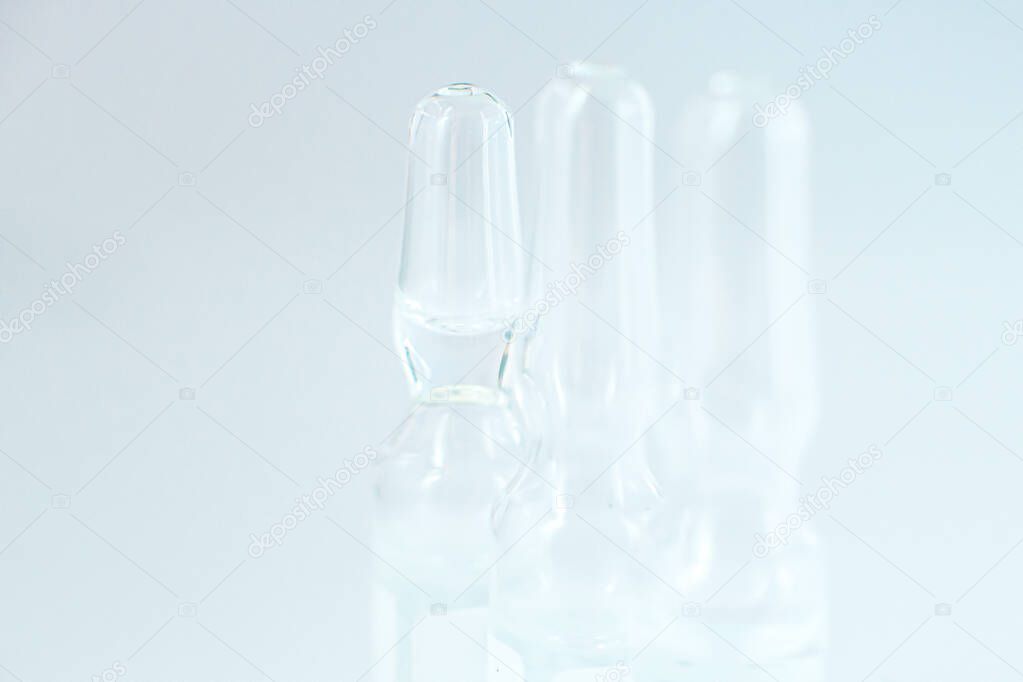 Coronavirus vaccine macro ampoule concept. Blurred background photo
