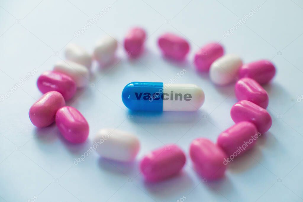 Colored pills close-up. Coronavirus vaccine concept macro