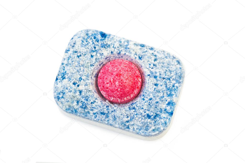 Dishwasher tablet isolated on a white background in a close up and top view