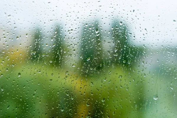 Rain drops on the autumn window, urban background — Stock Photo, Image