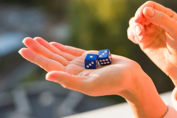 Dice 1 3 in the female hand, sunset background. Gambling devices. — Stock Photo, Image