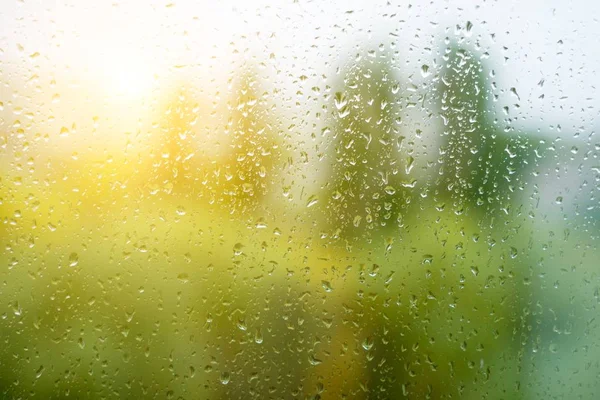 Rain drops on the autumn window, urban background — Stock Photo, Image