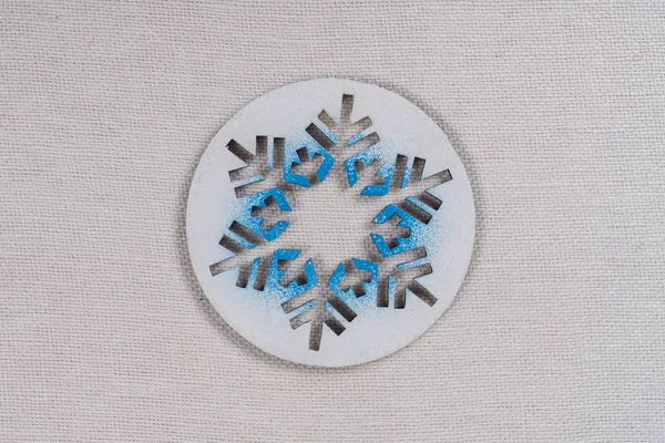 Background picture symbolic snowflake on a white background.