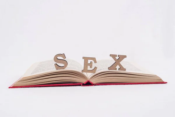 Palabra sexo abstracto letras, fondo blanco libro abierto —  Fotos de Stock