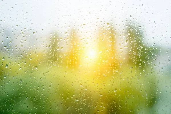 Large Raindrops on the autumn window, sunset background — Stock Photo, Image