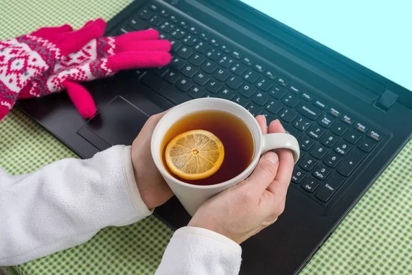 Winter background - picture, laptop, gloves, sweater, hot tea. — Stock Photo, Image