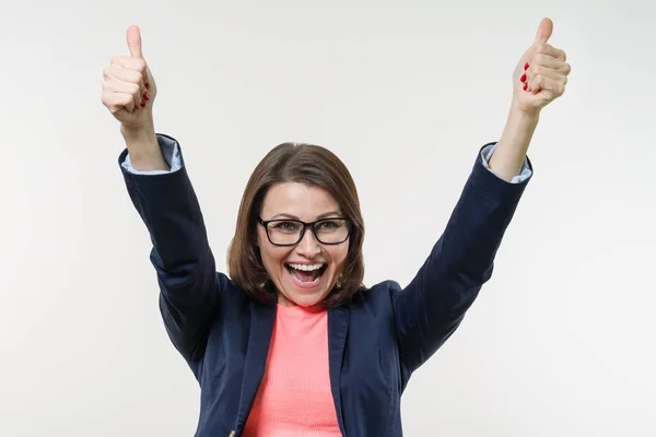 Portrait of happy mature businesswoman with thumbs up. White — Stock Photo, Image