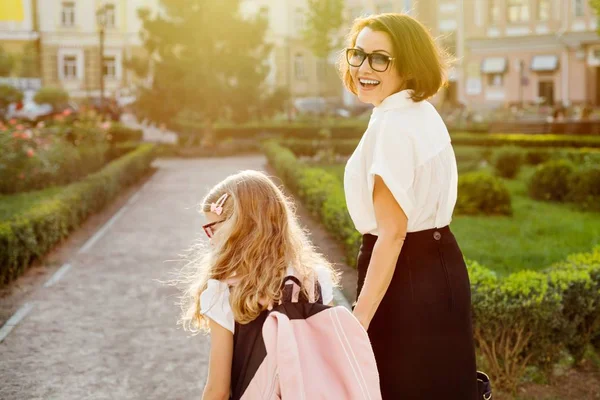 Parent holding child by the hand, go to school. — Stock Photo, Image