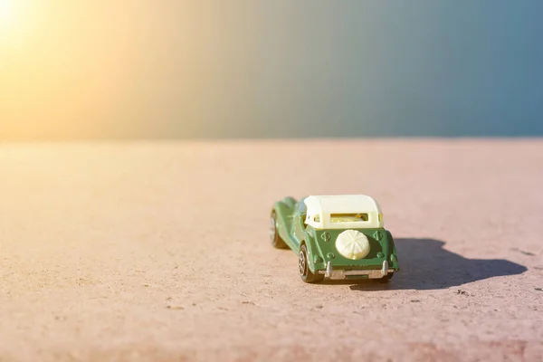 Toy retro car - symbol of travel and adventure — Stock Photo, Image
