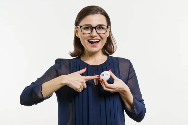 A Businesswoman holds an egg in her hands with an abstract vision text. — Stock Photo, Image