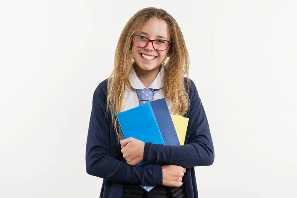 Menina adolescente, estudante do liceu. Poses em um fundo branco — Fotografia de Stock