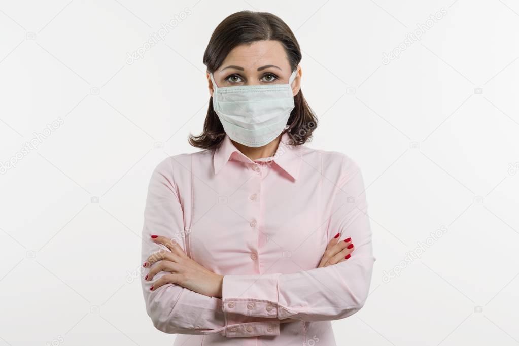 Business woman fears the virus and wears a face mask