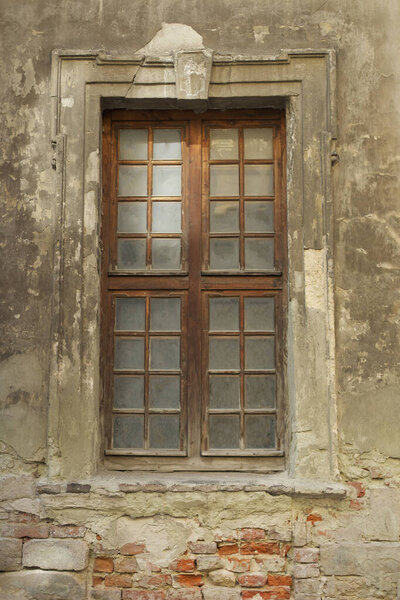 Old wooden window in an old non-residential building,