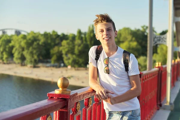 Outdoor portrait of smiling young male with fashionable haircut — Stock Photo, Image