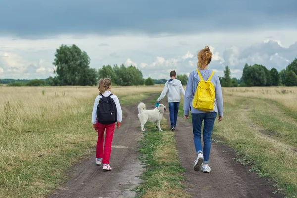 Active healthy lifestyle, children outdoors with dog — Stock Photo, Image