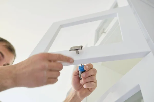 Working hands of male carpenter assembling furniture — Stock Photo, Image