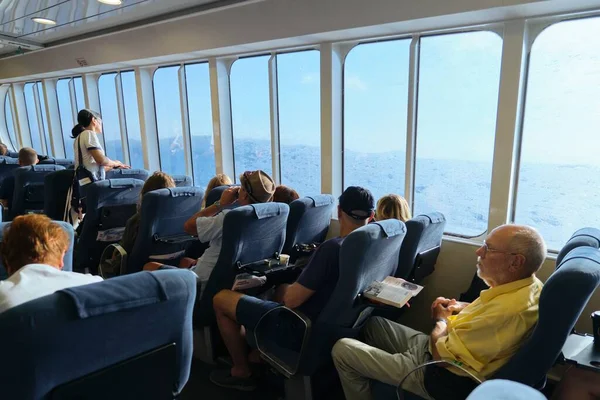 stock image Greece, Crete. 11-09-2019. Passengers sitting in cabin of Greek ferry SeaJets, trip Heraklion Port Desk Santorini Cruise.