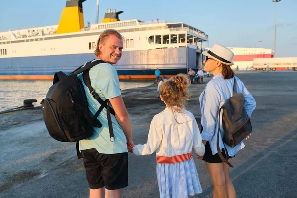 Sea family vacation, mother father and daughter child in seaport