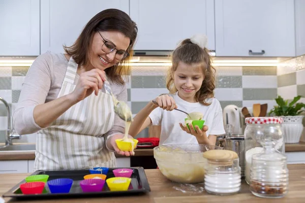 Mother Daughter Cooking Muffins Together Home Kitchen Female Child Pouring — Stock Photo, Image