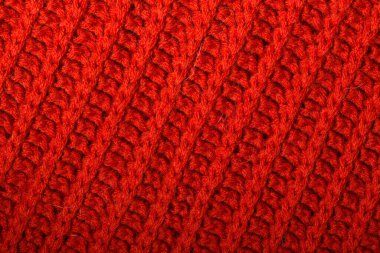 Kırmızı örgü yün dokusu arkaplan olarak kullanılabilir.