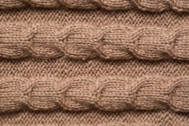 Örülmüş kumaş arkaplan dokusu altın. Örgü süs..