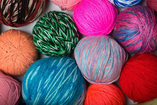 Colored balls of yarn. View from above. Rainbow colors. All colors. Yarn for knitting. Skeins of yarn.