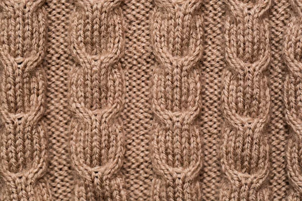 Pletená tkanina pozadí textura zlato. Pletené ozdoby. — Stock fotografie