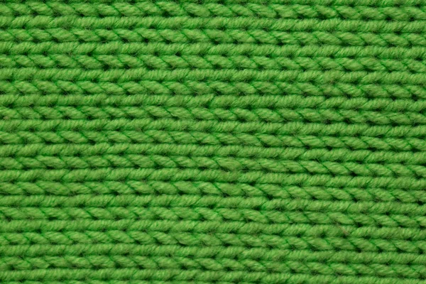 Tessuto lavorato a maglia sfondo texture è verde. Ornamento . — Foto Stock