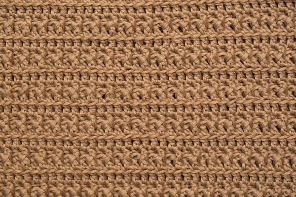 Tissu tricoté fond texture or. Ornement tricoté . — Photo