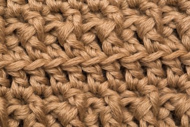 Örülmüş kumaş arkaplan dokusu altın. Örgü süs..