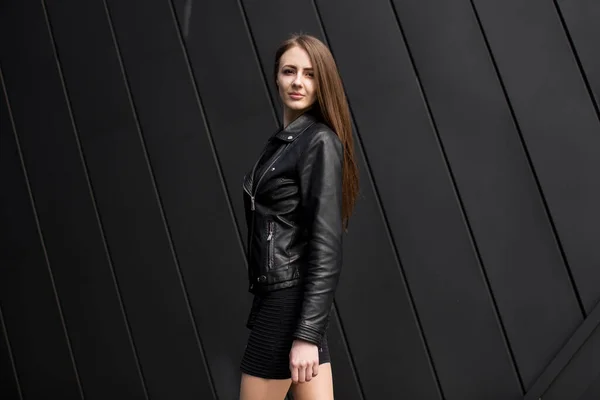 Fashion style photo of beautiful young woman on black background wall — Stock Photo, Image