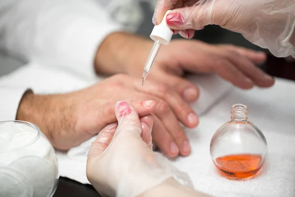 Manicure, Hands spa Cuticle oil. Beautiful man hands closeup. Manicured nails. Beauty hands. Beauty treatment