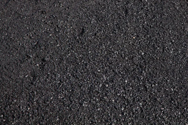 Road repairs, material for asphalt close-up, texture of the material. — Stock Photo, Image